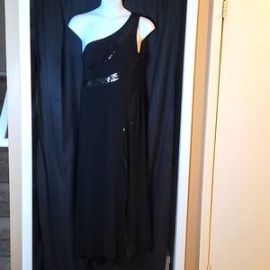 Once used, one shoulder black gown with sequin.